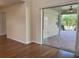 Brightly lit patio features ceiling fan and view of well-manicured yard at 20101 Oakflower Ave, Tampa, FL 33647