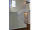 White staircase provides access to the second floor of the home at 20101 Oakflower Ave, Tampa, FL 33647