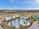 Aerial view of community amenities including pool, clubhouse, and tennis courts at 22359 Storybook Cabin Way, Land O Lakes, FL 34637