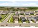 Beautiful aerial shot of a suburban neighborhood featuring well-maintained lawns and modern homes at 22359 Storybook Cabin Way, Land O Lakes, FL 34637