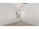 Bright bedroom with neutral carpet and window view at 22359 Storybook Cabin Way, Land O Lakes, FL 34637