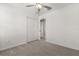 Bright bedroom features a ceiling fan, closet, and neutral carpet at 22359 Storybook Cabin Way, Land O Lakes, FL 34637