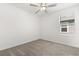 Small bedroom featuring carpet, ceiling fan, and a window at 22359 Storybook Cabin Way, Land O Lakes, FL 34637