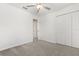 Bedroom with neutral carpet, a ceiling fan and closet at 22359 Storybook Cabin Way, Land O Lakes, FL 34637