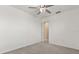 Neutral carpet in a bright bedroom with ceiling fan at 22359 Storybook Cabin Way, Land O Lakes, FL 34637