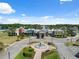 Clubhouse featuring a circular fountain, palm trees and a grand entrance at 22359 Storybook Cabin Way, Land O Lakes, FL 34637