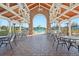 Stunning community pool view with outdoor seating and beautiful archway at 22359 Storybook Cabin Way, Land O Lakes, FL 34637