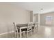 Neutral dining area with white trim and lots of natural light at 22359 Storybook Cabin Way, Land O Lakes, FL 34637