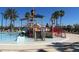 Community water park area featuring slides and splash pads for summer fun at 22359 Storybook Cabin Way, Land O Lakes, FL 34637