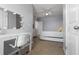Bedroom featuring neutral walls, carpet flooring, a desk and lighted mirror at 2699 Suncoast Blend Dr, Odessa, FL 33556