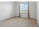Bedroom featuring neutral walls, carpet flooring and a window with views of the outdoors at 2699 Suncoast Blend Dr, Odessa, FL 33556