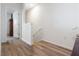 Bright hallway features light-colored wood floors and fresh white walls at 2699 Suncoast Blend Dr, Odessa, FL 33556