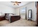 Spacious main bedroom with soft carpeting, a fan, a mirror, and lots of natural light at 2699 Suncoast Blend Dr, Odessa, FL 33556