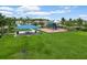 Exterior image of a picnic area next to a playground with play equipment under a shaded awning at 2699 Suncoast Blend Dr, Odessa, FL 33556