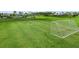 Exterior shot of a well-maintained soccer field with lush green grass, providing an ample play area at 2699 Suncoast Blend Dr, Odessa, FL 33556