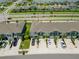 Aerial street view of modern townhomes with well-manicured lawns and driveways with parked cars at 2699 Suncoast Blend Dr, Odessa, FL 33556