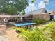 Inviting outdoor space featuring a ping pong table and shaded seating area, perfect for relaxation and entertainment at 2707 56Th S St, Gulfport, FL 33707