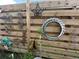 Rustic backyard fence featuring an assortment of eclectic decorations giving the space a charming, artistic feel at 2707 56Th S St, Gulfport, FL 33707