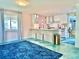 Bright kitchen with white cabinetry, modern appliances, island seating, and open layout at 2707 56Th S St, Gulfport, FL 33707
