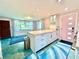 Well-designed kitchen with an island, modern appliances, and an inviting dining area at 2707 56Th S St, Gulfport, FL 33707