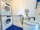 Convenient laundry area features a stackable washer and dryer set and a water heater at 2707 56Th S St, Gulfport, FL 33707