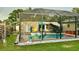 Backyard view of the screened pool, a flamingo, and lush green grass at 2707 56Th S St, Gulfport, FL 33707