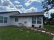Home exterior featuring a well-maintained backyard and patio at 2900 Grovewood Blvd # A, Palm Harbor, FL 34683