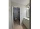 Clean bathroom with white vanity, toilet, and tiled shower, offering modern fixtures at 2900 Grovewood Blvd # A, Palm Harbor, FL 34683