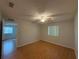 Bright bedroom with a ceiling fan and light wood floors, offering a peaceful retreat at 2900 Grovewood Blvd # A, Palm Harbor, FL 34683