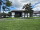 Charming single-story home with well-maintained lawn, mature tree, and welcoming front entrance at 2900 Grovewood Blvd # A, Palm Harbor, FL 34683
