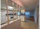 An open-concept kitchen with a view to the living room at 2900 Grovewood Blvd # A, Palm Harbor, FL 34683