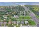 Scenic aerial view of a residential neighborhood with a waterfront bridge in the background at 3113 Chamblee Ln, Clearwater, FL 33759