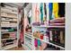 A spacious walk-in closet with custom shelving provides ample storage for clothes, shoes, and accessories at 3113 Chamblee Ln, Clearwater, FL 33759