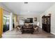 Open dining area with hardwood floors, large windows, and a modern table set, perfect for entertaining at 3113 Chamblee Ln, Clearwater, FL 33759