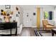 Welcoming entryway with modern decor, stylish console, and warm natural light at 3113 Chamblee Ln, Clearwater, FL 33759