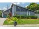 Charming home exterior with well-maintained landscaping, unique decorations, and vibrant curb appeal at 3113 Chamblee Ln, Clearwater, FL 33759