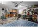 Garage features organized storage and a rug, creating a functional and tidy space at 3113 Chamblee Ln, Clearwater, FL 33759