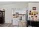 Well-lit kitchen featuring white cabinets, stainless steel appliances, and a stylish island at 3113 Chamblee Ln, Clearwater, FL 33759