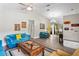 Inviting living room with vaulted ceilings, hardwood floors, and modern furnishings creating a cozy atmosphere at 3113 Chamblee Ln, Clearwater, FL 33759