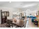 Bright, open-concept living and dining area with wood floors and stainless steel appliances at 3113 Chamblee Ln, Clearwater, FL 33759