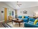 Inviting living room with blue sofas, a wooden coffee table, and a cozy atmosphere at 3113 Chamblee Ln, Clearwater, FL 33759
