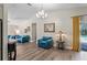 Bright living room area with vaulted ceiling and sliding glass door to screened pool and lanai at 3113 Chamblee Ln, Clearwater, FL 33759