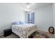 Cozy bedroom with neutral decor, carpeted floors, and a comfortable bed for a peaceful night's sleep at 3115 Gina Ct, Holiday, FL 34691