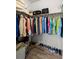 Walk-in closet offering ample storage with shelving and rods for organized clothing and accessories at 3115 Gina Ct, Holiday, FL 34691