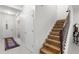 Bright entryway featuring tile floors, staircase, and a charming rug that welcomes you home at 3115 Gina Ct, Holiday, FL 34691