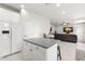 Open concept kitchen featuring white cabinets, granite counters, and stainless appliances at 3115 Gina Ct, Holiday, FL 34691