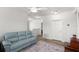 Spacious living room with wood floors, a comfortable couch, and an open layout for easy movement at 3115 Gina Ct, Holiday, FL 34691