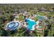 Aerial view of the community splash pad, pools and tennis courts at 3241 Evening Breeze Loop, Wesley Chapel, FL 33544
