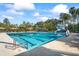 Large community pool with a slide and many lounge chairs available for residents at 3241 Evening Breeze Loop, Wesley Chapel, FL 33544