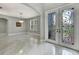 Bright foyer with decorative doors, chandelier and shiny tile flooring at 3241 Evening Breeze Loop, Wesley Chapel, FL 33544